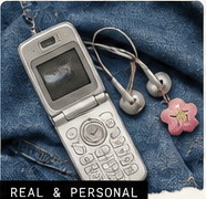Flip phone and wired earbuds on denim